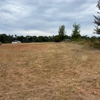 Wide open field graded and cleared of brush