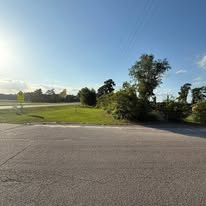 Roadside lot cleared and mowed along the highway